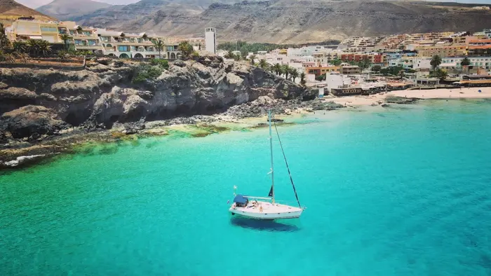 KATE anchored in turquoise water